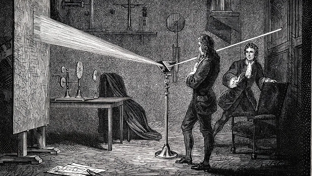 Isaac Newton using prism to break white light into spectrum Isaac Newton using a prism to break white light into the visible spectrum © Getty Images