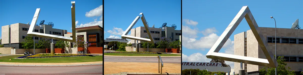 three images of triangle sculpture from different angles.